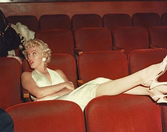 marilyn monroe sitting in the movies